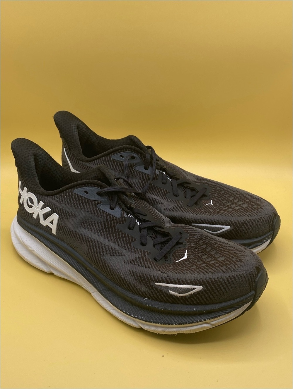 HOKA Clifton 9 in black and white